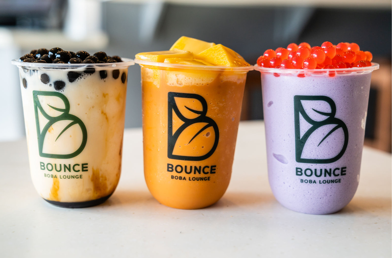 Three colorful boba drinks ready to share at Bounce Boba Lounge